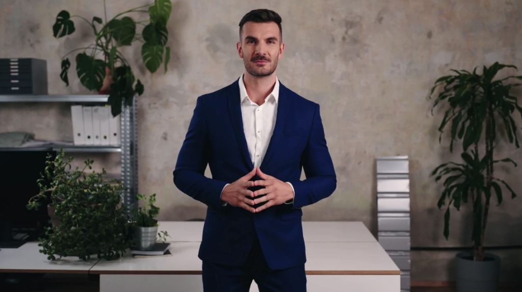 Dave - Investing and Trading Strategist standing in office